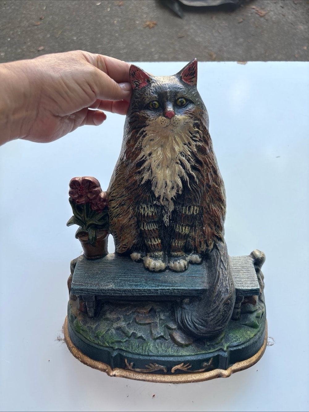 The Vintage 90's Upper Deck Cast Iron Cat Doorstop Decor is a charming and uniqu